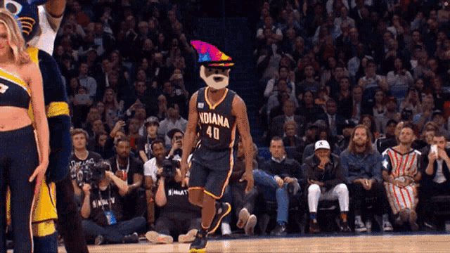 a basketball player for the indiana pacers wears a colorful hat