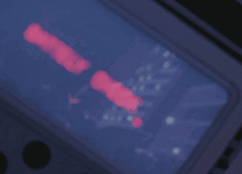 a blurred image of a screen with a red glow