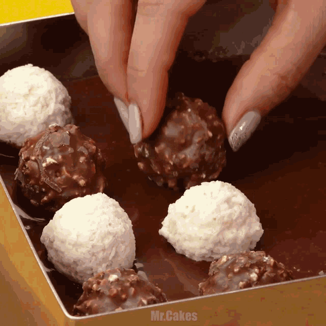 a box of chocolates with the words mr.cakes written on the bottom