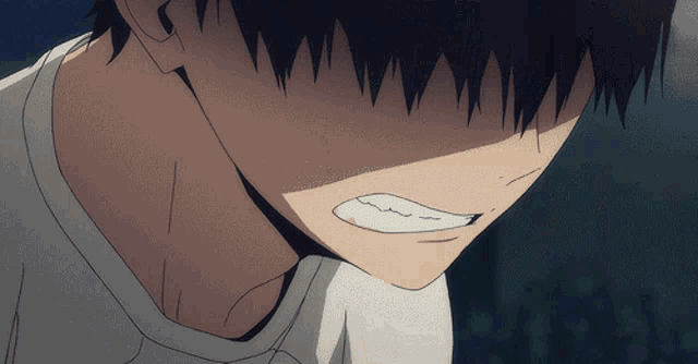 a close up of a person 's face with a very angry expression
