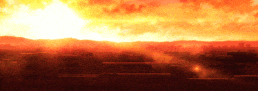 a sunset over a city with a few buildings in the foreground