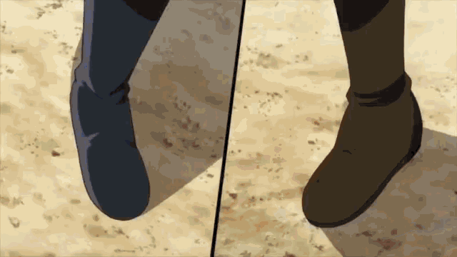 a close up of a person 's feet standing on a dirt ground