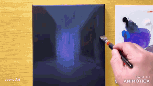 a person painting on a canvas with the words made in animatica on the bottom right