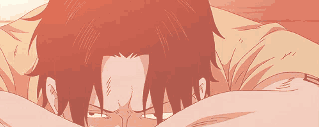 a close up of a person laying down with their head on their arms
