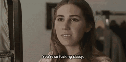 a woman is standing in front of a hanger and talking to someone .