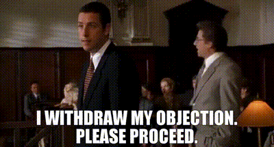 a man in a suit and tie says i withdraw my objection please proceed in a courtroom