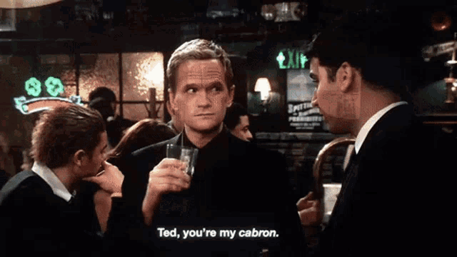 a man in a black suit says " ted you 're my cabron "