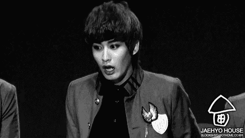 a black and white photo of a young man with jaehyo house written on the bottom