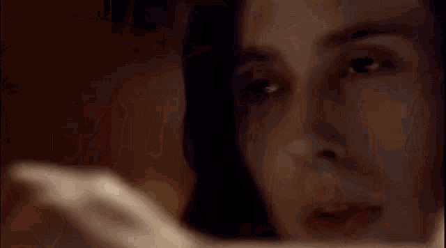 a close up of a man 's face with a white cloth covering his face .