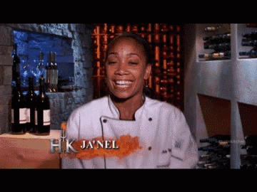 a woman in a chef 's uniform with the name hk janel on her chest