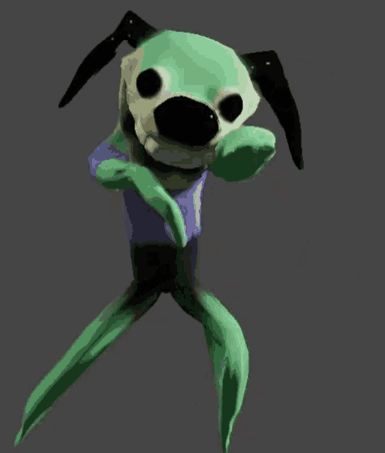 a green and black dog with a blue shirt on