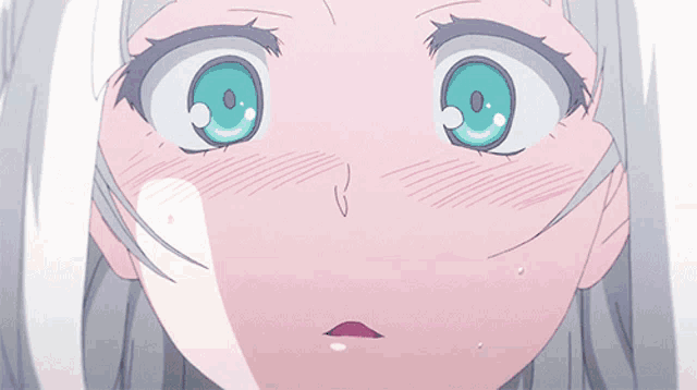a close up of a girl 's face with her eyes glowing in the shape of a heart