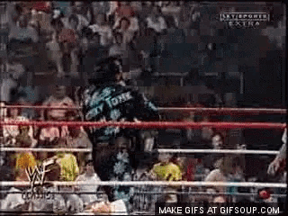 a man in a wrestling ring is wearing a shirt that says tommy tony