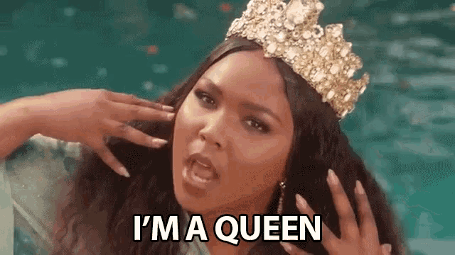 a woman wearing a crown is screaming and says `` i 'm a queen '' .