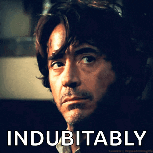 a close up of a man 's face with the words indubitable on the bottom right