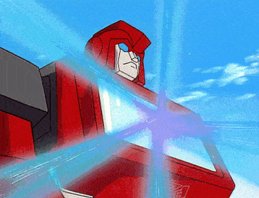 a red transformer with a blue light coming out of it 's head