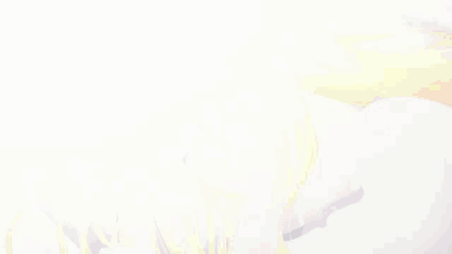 a girl with blonde hair is sleeping in a bed with her eyes closed