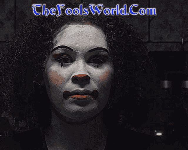 a picture of a clown with the website thefoolsworld.com in the corner