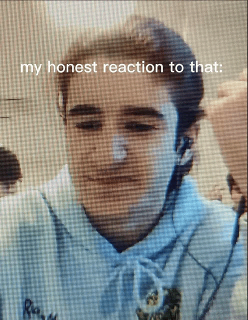 a young man wearing ear buds and a hoodie with the words " my honest reaction to that " on the bottom