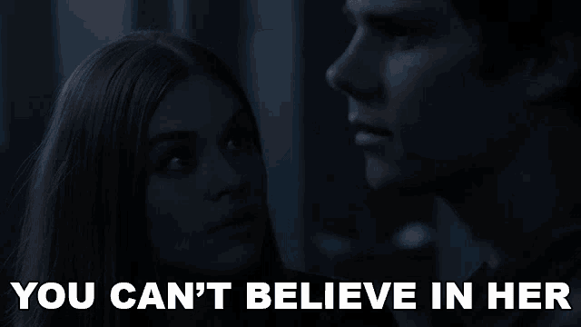 a man and a woman looking at each other with the words " you can 't believe in her " below them
