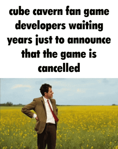 a man in a suit and tie stands in a field of flowers