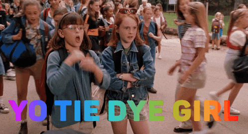 a group of children are walking down a sidewalk and the words yo tie dye girl are displayed