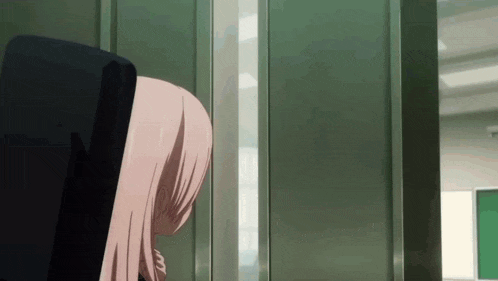 a girl with pink hair is standing in a doorway looking out a window .