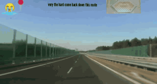 a highway with the words very the hard come back down this route above it