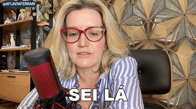 a woman sitting in front of a microphone with the words sei la written on the bottom