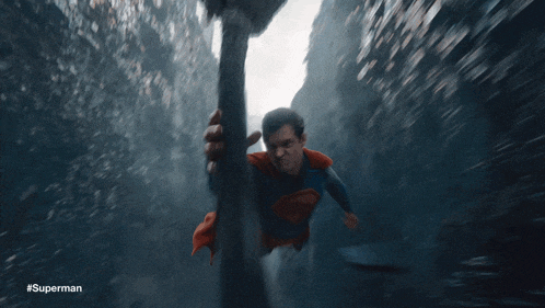 a blurred image of superman with the hashtag #superman