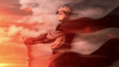 a man in a red cape is holding a sword in his hand .