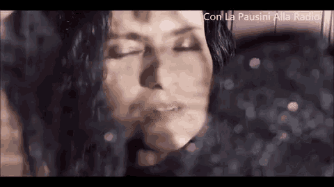 a close up of a woman 's face with her eyes closed