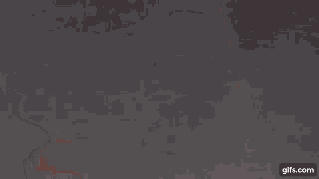 a close up of a person 's face with a gray background