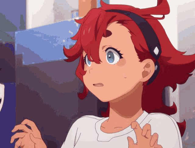 a girl with red hair and blue eyes is wearing headphones