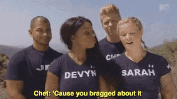 a group of people are standing next to each other and one of them is wearing a shirt that says devyn