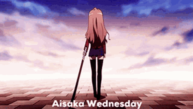 a girl is standing on a brick floor holding a stick and the words aisaka wednesday are above her .