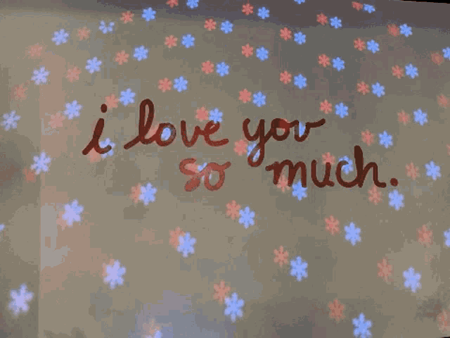 a sign that says i love you so much with snowflakes on it