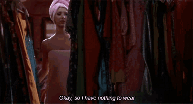 a woman wrapped in a pink towel says " okay so i have nothing to wear "