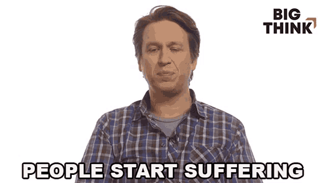a man in a plaid shirt says people start suffering in front of a big think logo