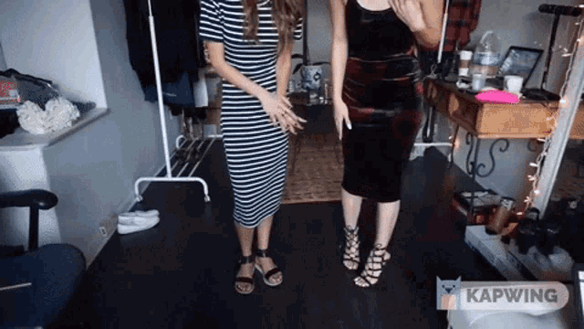two women are standing next to each other in a room with the words kapwing on the bottom right