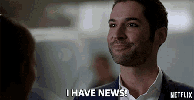 a man in a suit is smiling and says i have news