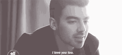 a black and white photo of a man with the words `` i love you too '' written on it .
