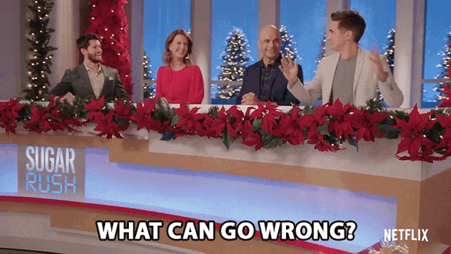 a group of people sitting at a table with the words what can go wrong on the bottom