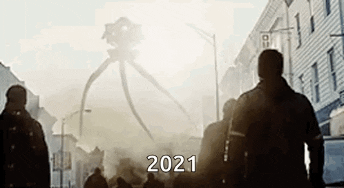 a group of people are walking down a street in front of a giant tripod .