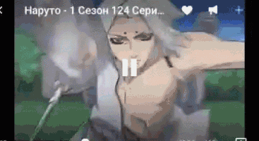 a screenshot of a video of a man without a shirt holding a sword .