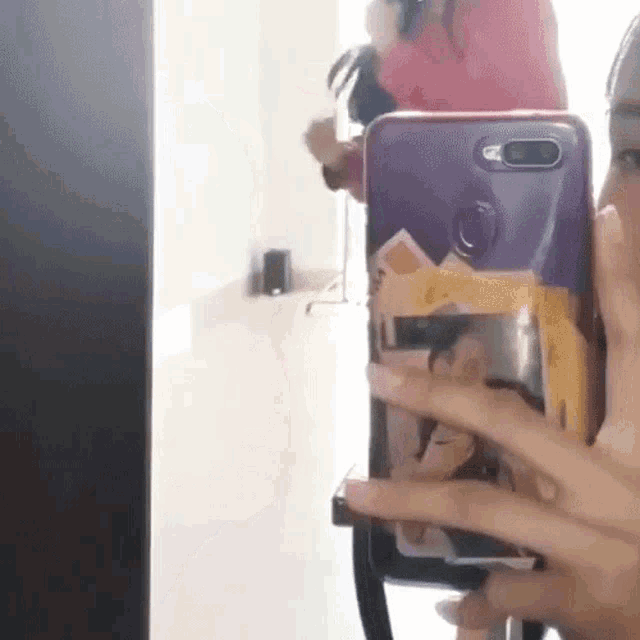 a person is taking a picture of themselves with a phone