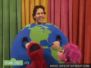 a sesame street gif shows elmo and oscar holding a giant globe
