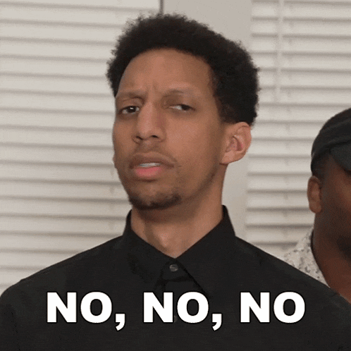 a man in a black shirt has the words no , no , no written on his chest