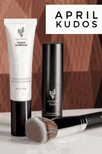 a bottle of april kudos cosmetics with a brush