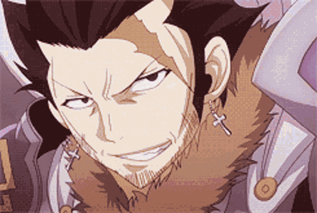 a close up of a man with a beard wearing earrings